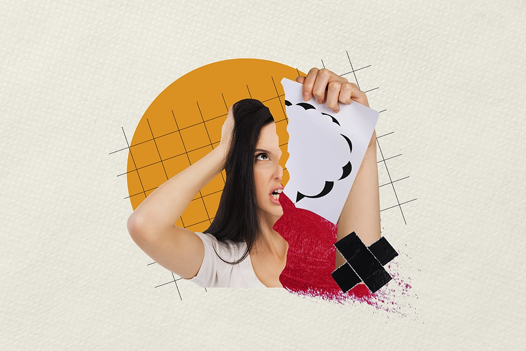 Mujer con gesto frustrado, rompiendo una ilustración en papel, que representa las tensiones relacionadas con personalidades como psicópata y narcisista.