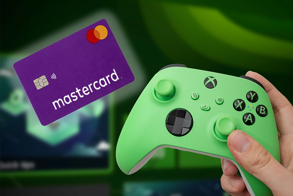 Control de videojuego Xbox y tarjeta Mastercard, simbolizando la posibilidad de acceder a beneficios como PS Game Pass con métodos de pago digitales.